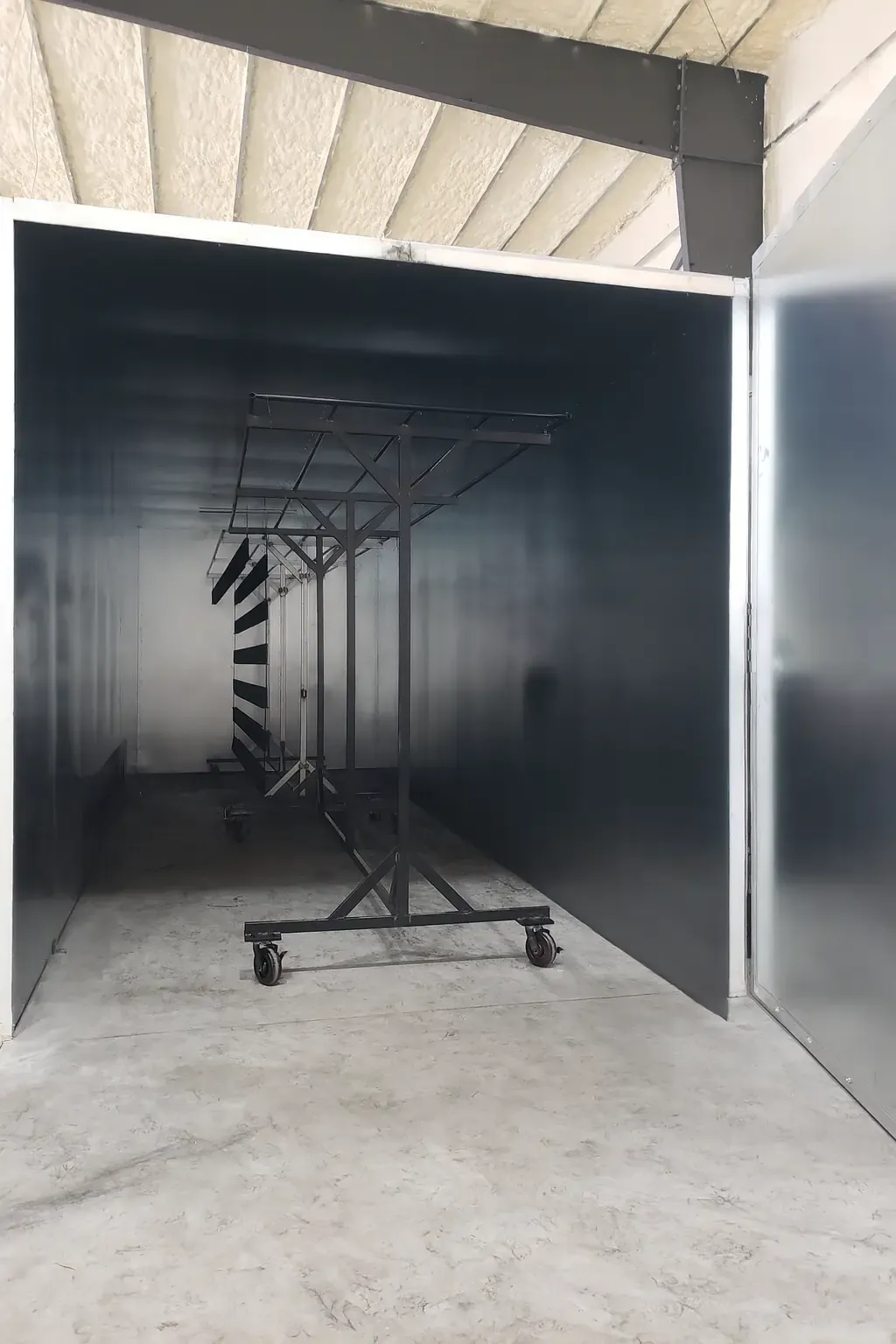 Interior of XL Industrial Powder Coating's 30-foot oven showing large capacity for oversized parts